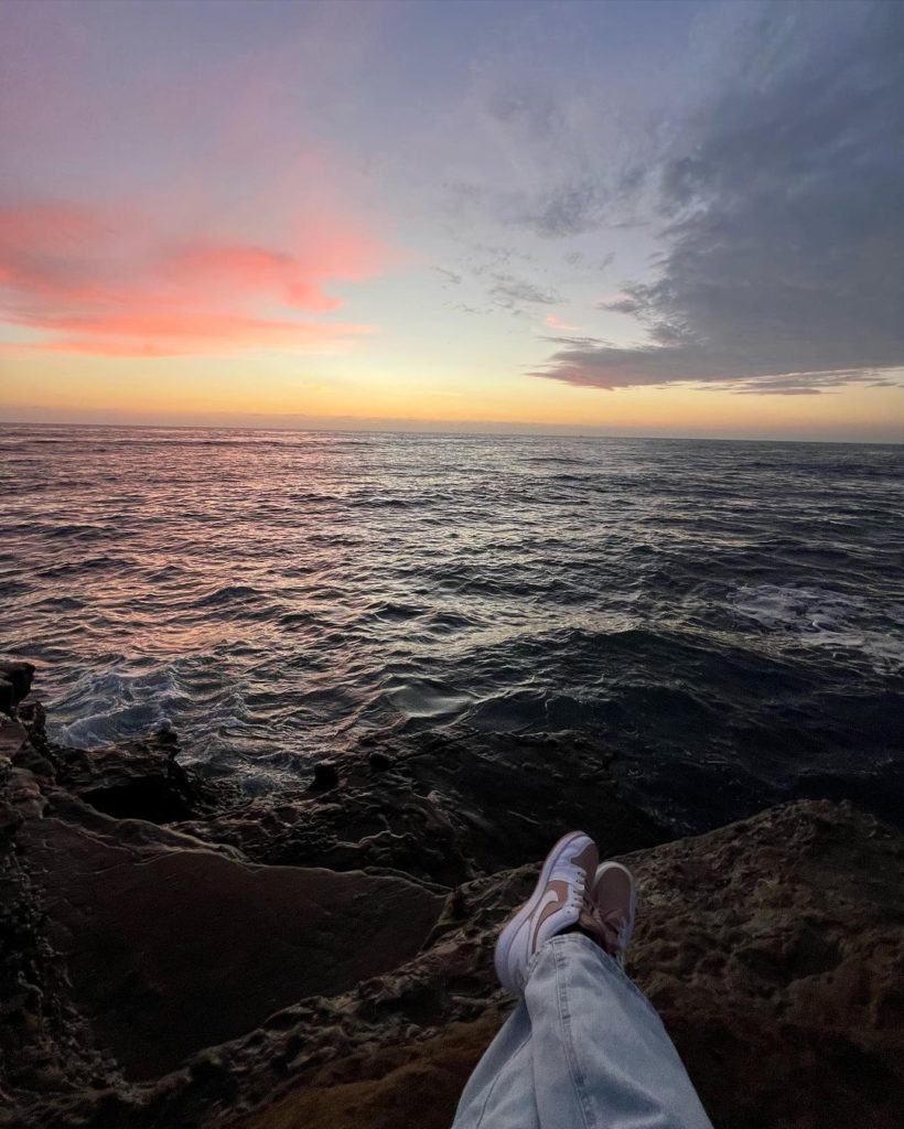 Sitting on cliffs overlooking ocean