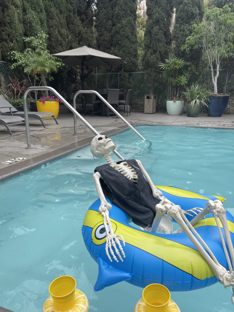 toy skeleton relaxing in the pool