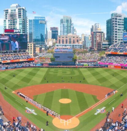 Wide-angle view of Petco Park filled with fans and downtown San Diego skyline.