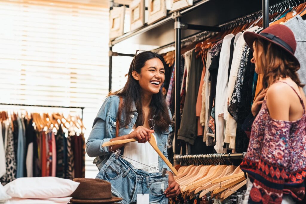 two women shopping in a clothing store
