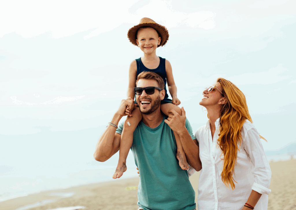 Happy family smiling on beach