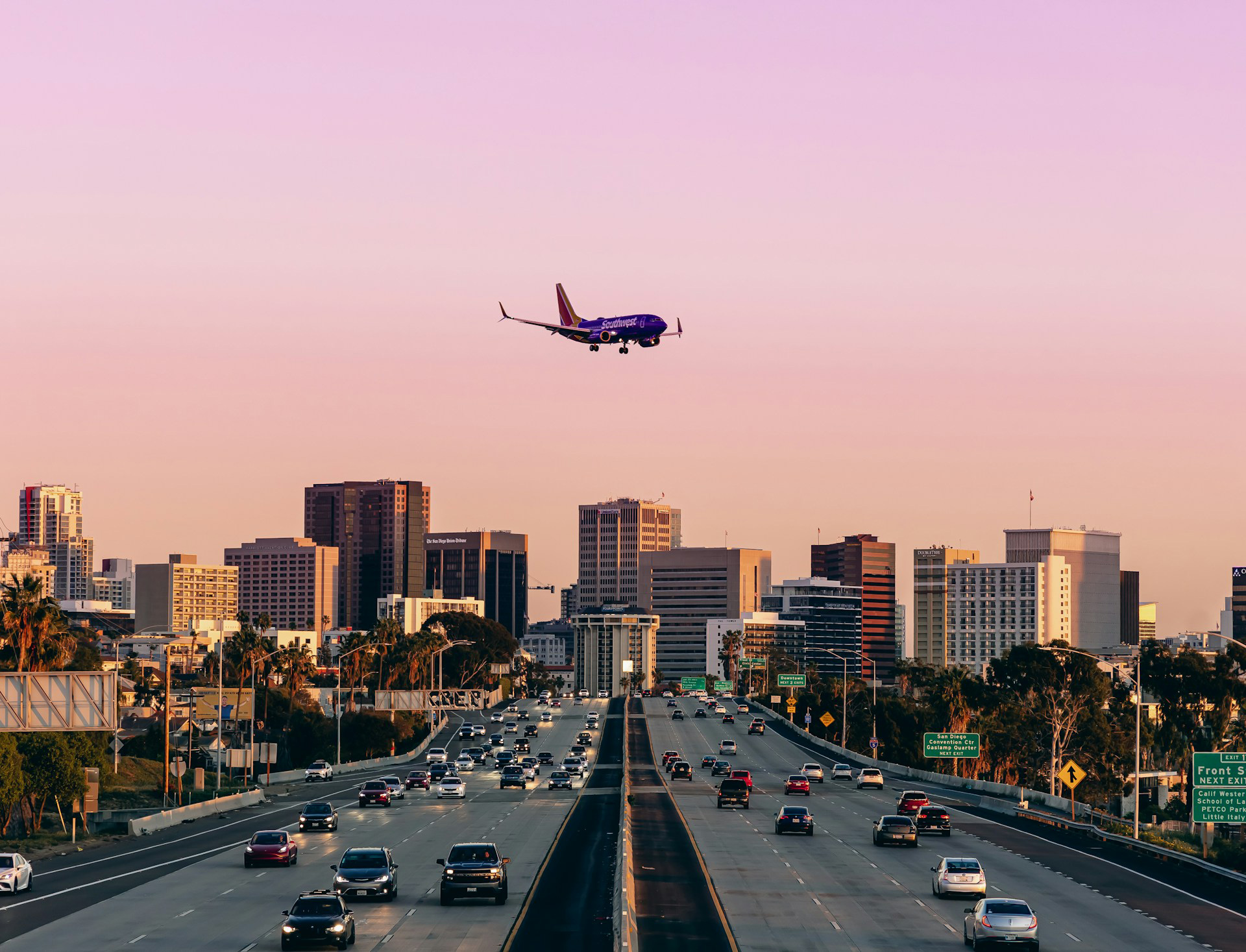 an airplane flying over San Diego