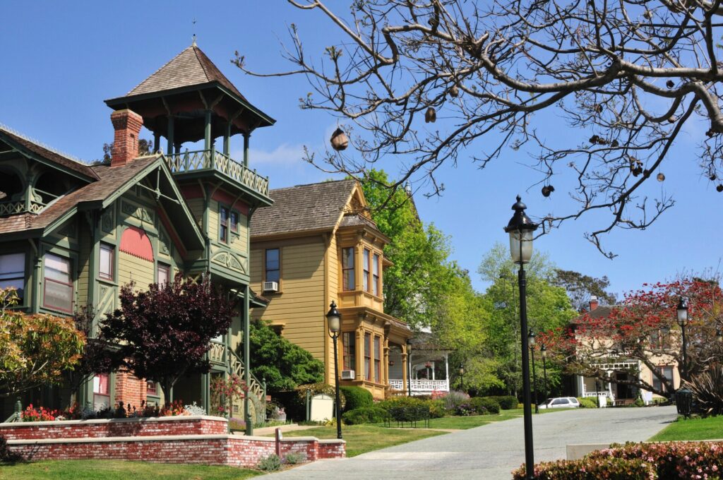 a large, colorfully painted victorian house