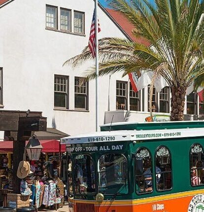 a trolly pulling up to Old Town San Diego