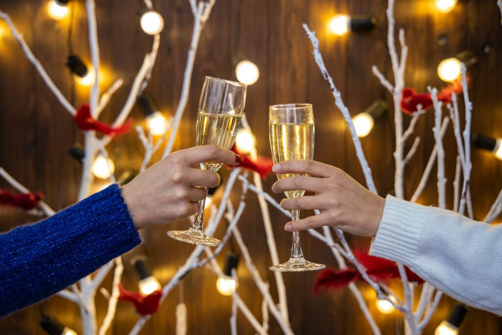 toasting champagne with christmas decorations