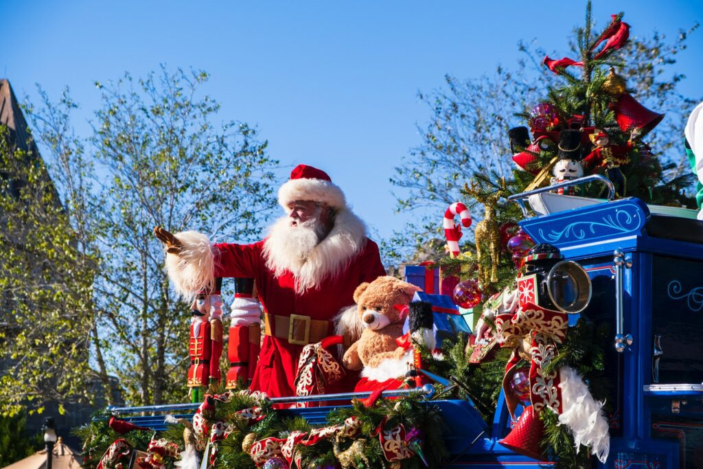 santa waving at a parade