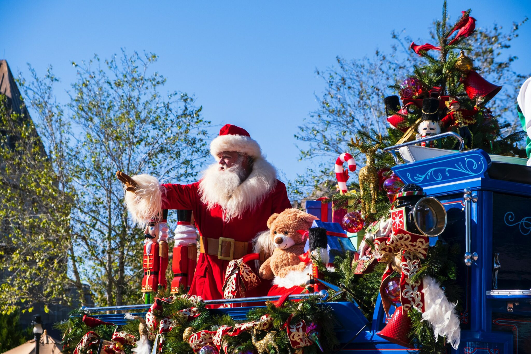 santa waving at a parade