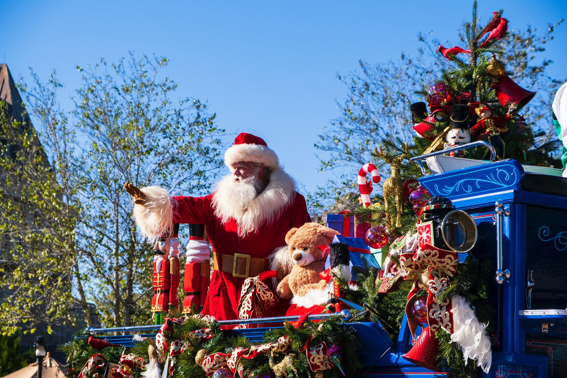 santa waving at a parade